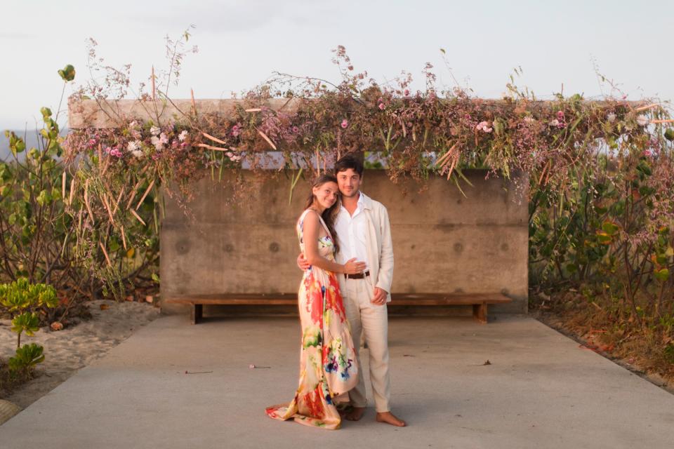 Us right after the ceremony; we ended standing under the Tadao Ando structure where we were wed. The flower sculpture above us was created by Fox Fodder Farm.