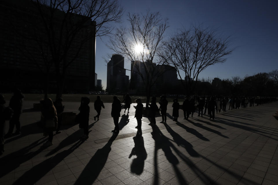 People queue in line to wait for coronavirus testing in Seoul, South Korea on Dec. 17, 2020. South Korea had seemed to be winning the fight against the coronavirus: Quickly ramping up its testing, contact-tracing and quarantine efforts paid off when it weathered an early outbreak without the economic pain of a lockdown. But a deadly resurgence has reached new heights during Christmas week, prompting soul-searching on how the nation sleepwalked into a crisis. (AP Photo/Lee Jin-man)