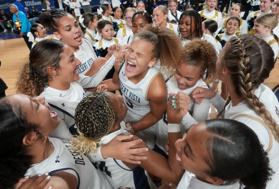 The Desert Vista Thunder celebrate their 63-37 win over the Millennium Tigers for the Open Division State Championship game at Arizona Veterans Memorial Coliseum on March 4, 2023, in Phoenix.
