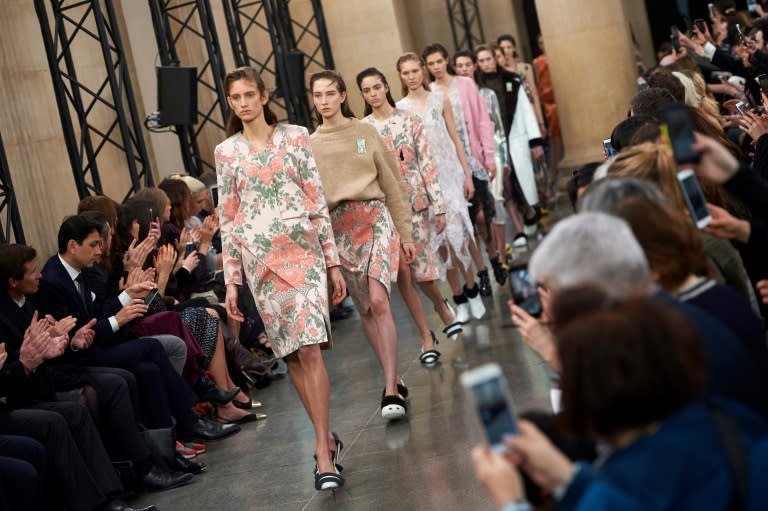 Models present creations by British fashion designer Christopher Kane during a catwalk show at the 2017 London Fashion Week