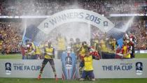 Arsenal celebrate with the trophy after winning the FA Cup Final. Action Images via Reuters / Carl Recine