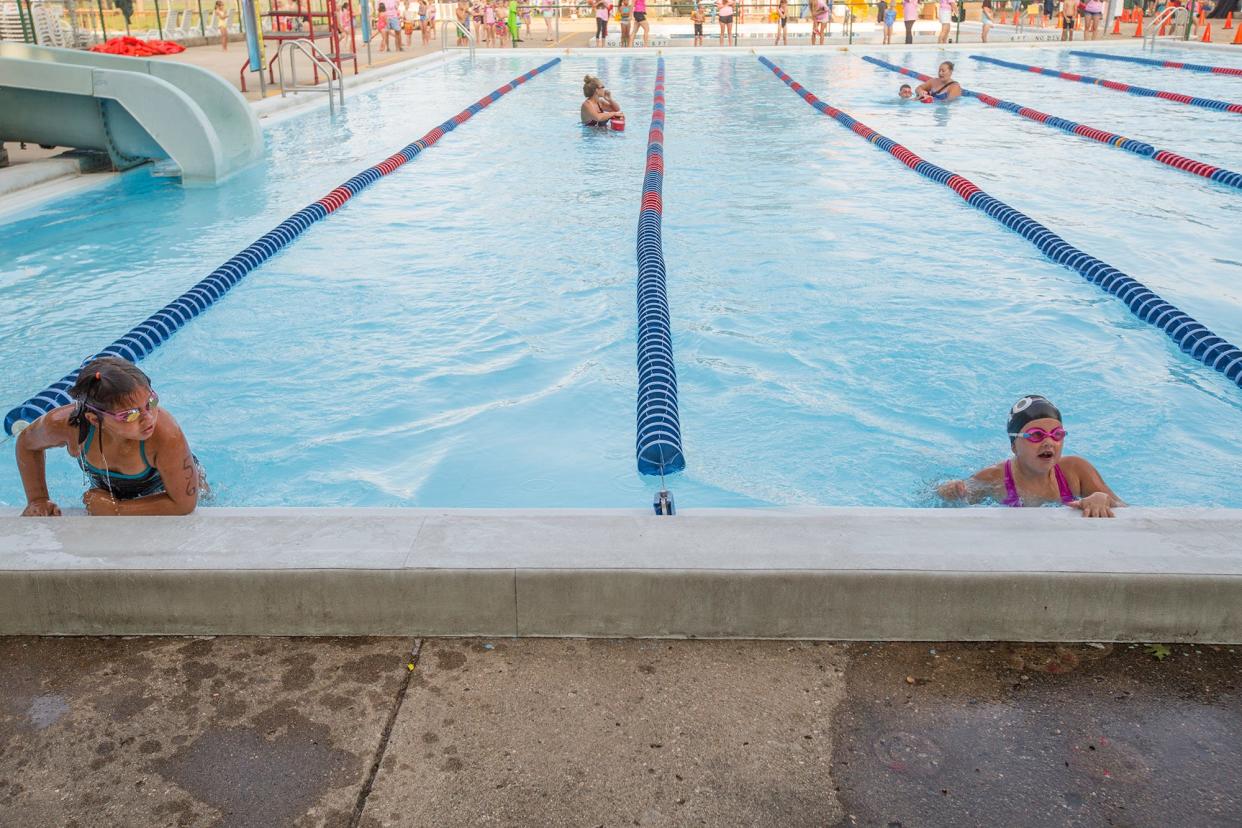 Two kids exit the pool at Potawatomi Park in South Bend. Nearly 7,000 visitors went to the pool in 2021, according to the city.