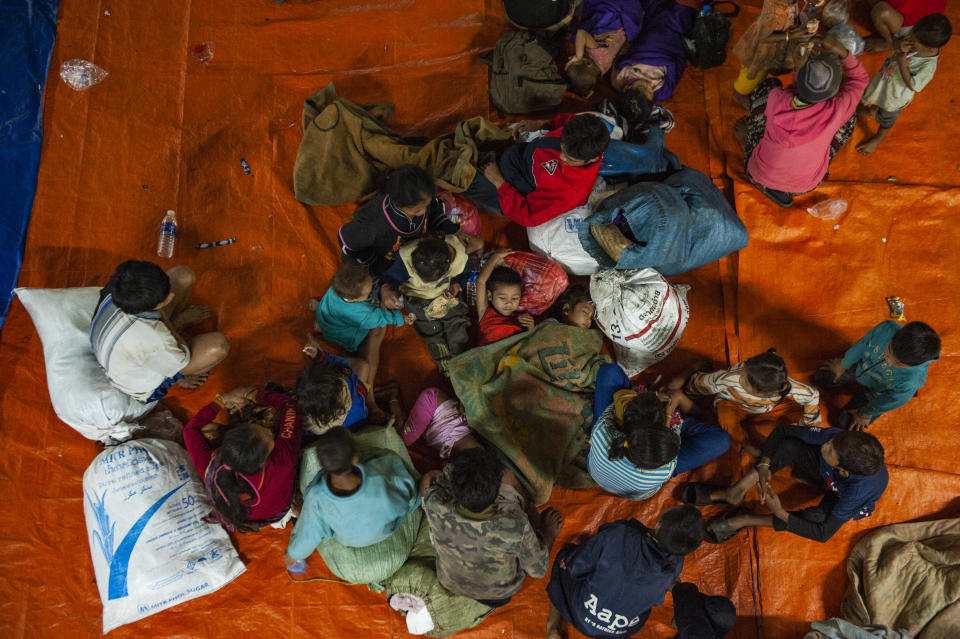 <p>Villagers from Sanam Say district take refuge in a makeshift evacuation center after they escaped the fast rising waters from the damaged dam on July 25, 2018 in Champasak, southern Laos. (Photo: Jes Aznar/Getty Images) </p>