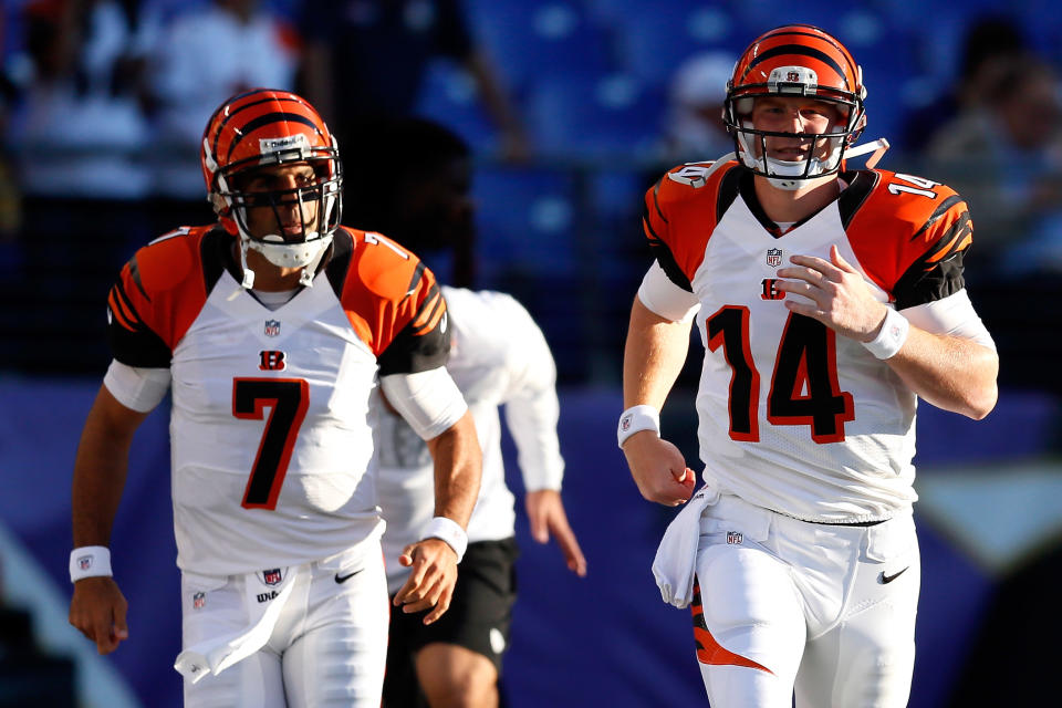 Quarterback Bruce Gradkowski #7 and quarterback Andy Dalton #14 of the Cincinnati Bengals run on the field before taking on the Baltimore Ravens at M&T Bank Stadium on September 10, 2012 in Baltimore, Maryland. (Photo by Rob Carr/Getty Images)