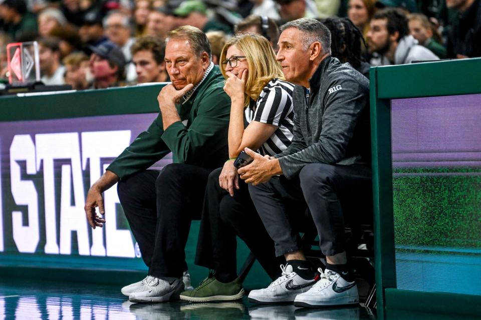 From left, Michigan State head coach Tom Izzo, MSU interim president Teresa Woodruff and Big Ten commissioner Tony Petitti look on during the MSU basketball scrimmage Saturday, Oct. 21, 2023, at the Breslin Center in East Lansing.