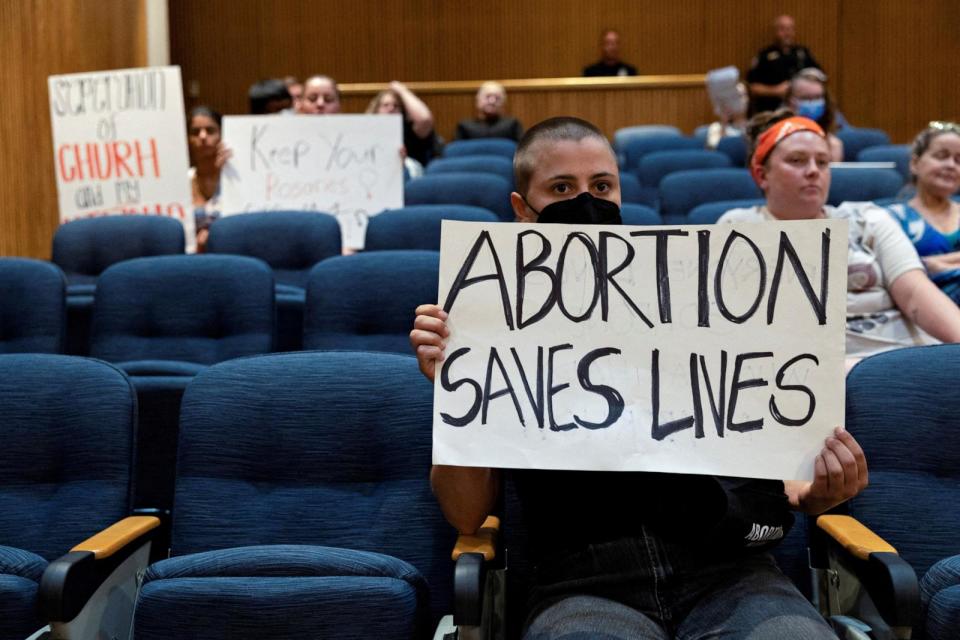 PHOTO: Abortion rights demonstrators attend Denton's city council meeting, June 28, 2022, in Denton, Texas. (Shelby Tauber/Reuters)