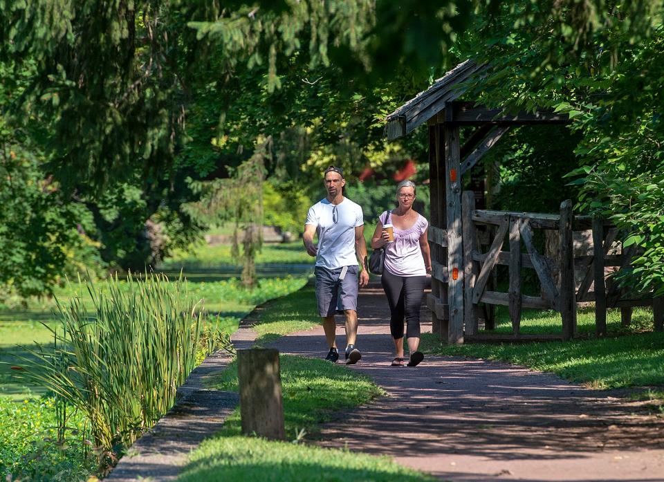 Vince DiCicco, left, and his wife, Anne, of Seaville, New Jersey, walk along the Delaware Canal State Park Towpath, near the Locktender's House in New Hope, on Friday, Sept. 9, 2022. ​​​​​​​The towpath is considered a part of the Circuit Trails network.