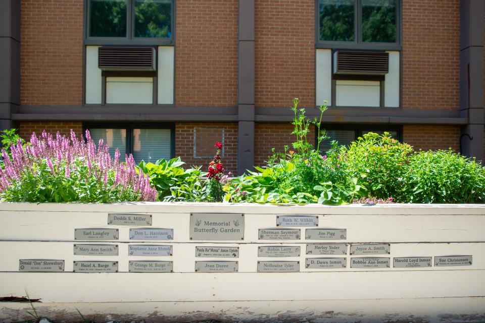 Memorial plaques are inscribed with names of past and present residents at Topeka Presbyterian Manor at the butterfly garden.