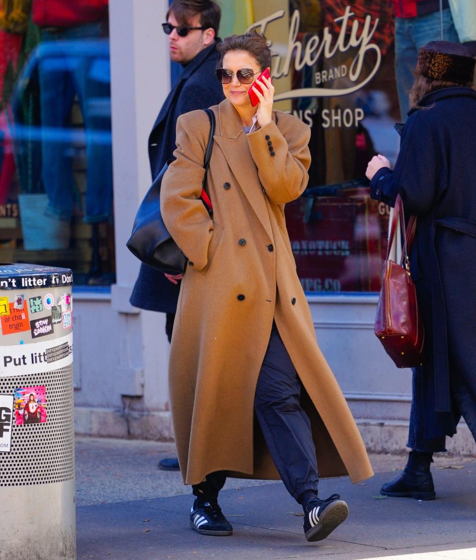 Katie Holmes embraces the sweeping coat