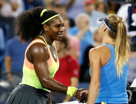 Aug 22, 2015; Cincinnati, OH, USA; Serena Williams (USA) shakes hands with Elina Svitolina (UKR) after their match in the semifinals during the Western and Southern Open tennis tournament at the Linder Family Tennis Center. Mandatory Credit: Aaron Doster-USA TODAY Sports