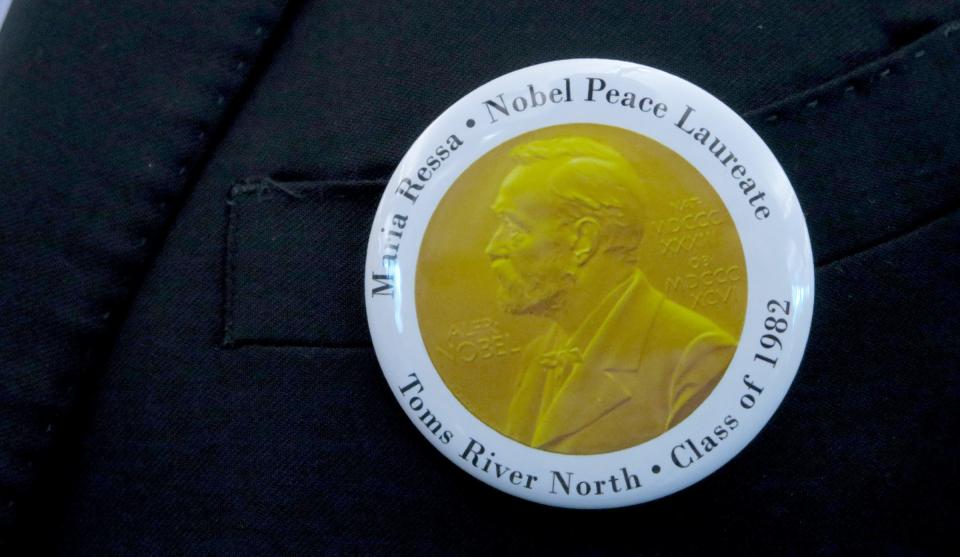 A button honoring Nobel Peace Prize recipient Maria Ressa is shown during a reception at Toms River North High School auditorium Monday, May 23, 2022.  Ressa, a 1982 graduate of the school, returned for induction into the Toms River Schools Hall of Fame and to have the newly renovated auditorium at North named after her.