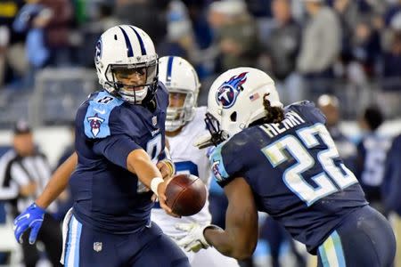 Oct 16, 2017; Nashville, TN, USA; Tennessee Titans running back Derrick Henry (22) rushes for 72 yards for a touchdown after getting the handoff from Titans quarterback Marcus Mariota (8) during the second half against the Indianapolis Colts at Nissan Stadium. Mandatory Credit: Jim Brown-USA TODAY Sports