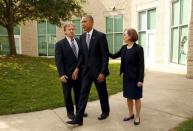 U.S. President Barack Obama walks away after meeting with families of victims of the shooting rampage in Roseburg, Oregon October 9, 2015. Flanking Obama are Rosberg Mayor Larry Rich and Oregon Governor Kate Brown. REUTERS/Kevin Lamarque