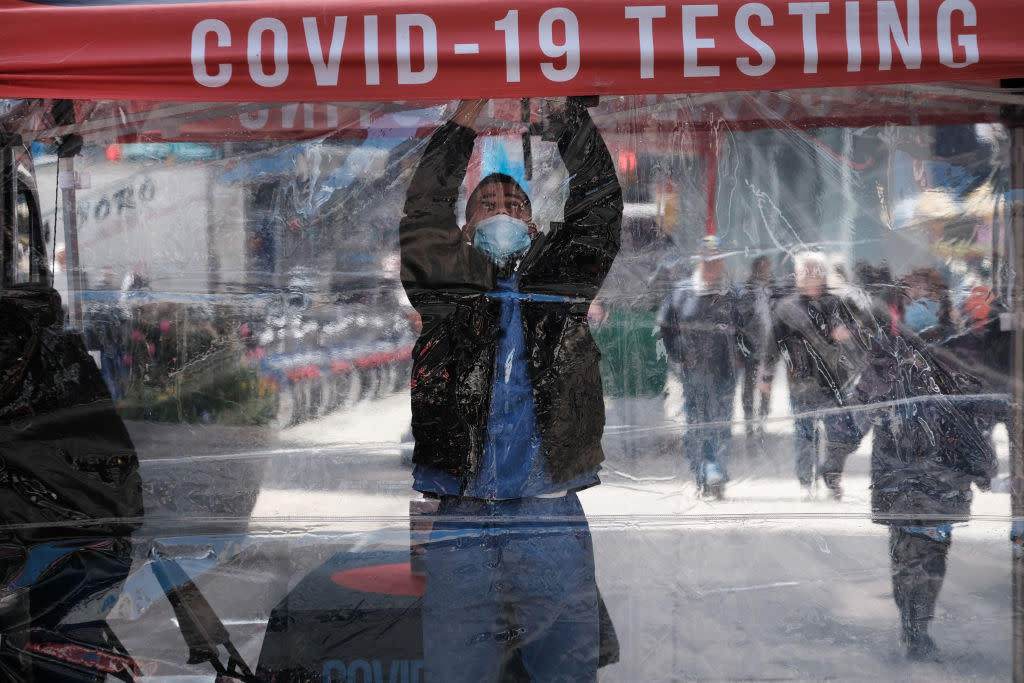 A health care worker at a COVID-19 test site