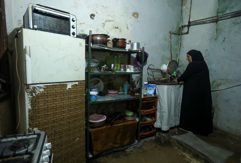 Mariam Khaled Maksoud works inside her kitchen in Tripoli