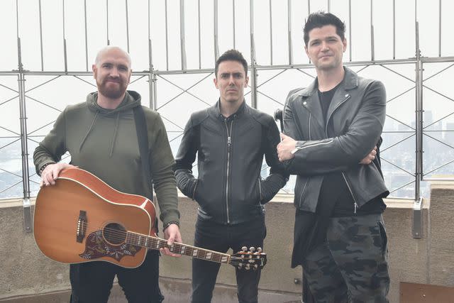 <p>Eugene Gologursky/WireImage</p> Mark Sheehan, Glen Power and Danny O'Donoghue of The Script Visit The Empire State Building at The Empire State Building on September 7, 2017 in New York City.