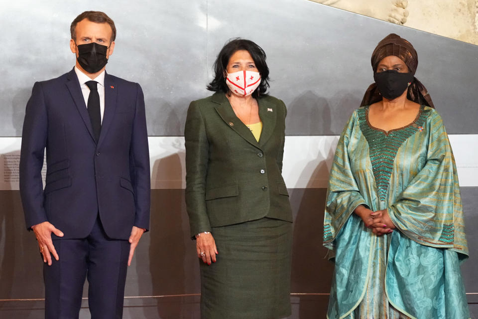 French president Emmanuel Macron, left, welcomes Georgian counterpart Salome Zurabishvili, center, with UN Women's Executive Director Phumzile Mlambo-Ngcuka, right, at an international conference aims to fast-track the road to gender equality and mobilize millions of dollars to achieve the long-sought goal quickly, at the Louvre Carrousel, in Paris, France, Wednesday, June 30, 2021. UN Women's Executive Director Phumzile Mlambo-Ngcuka said in an interview with The Associated Press that the underfunding of women's programs and the slow implementation of a 150-platform to achieve gender equality adopted by the world's nations in Beijing in 1995 "leaves a lot of women in a situation where they will never really realize their true and full potential." (AP Photo/Michel Euler)