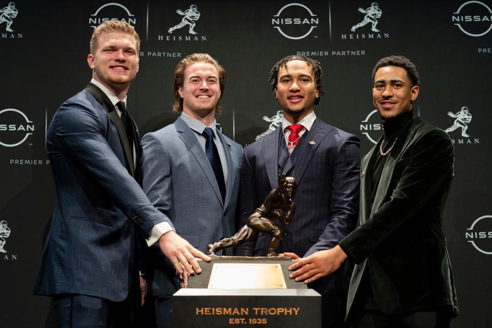 Heisman Trophy finalists, from left, Michigan defensive end Aidan Hutchinson, Pitt quarterback Kenny Pickett, Ohio State quarterback C.J. Stroud and Alabama quarterback Bryce Young