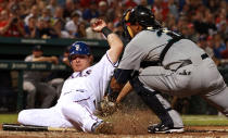 ARLINGTON, TX - APRIL 09: Josh Hamilton #32 of the Texas Rangers is called out at home against Miguel Olivo #30 of the Seattle Mariners at Rangers Ballpark in Arlington on April 9, 2012 in Arlington, Texas. (Photo by Ronald Martinez/Getty Images)