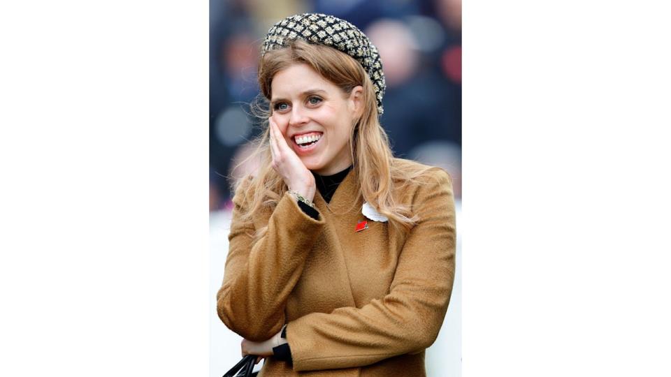 Princess Beatrice watches the racing as she attends day 3 'St Patrick's Thursday' of the Cheltenham Festival at Cheltenham Racecourse on March 14, 2024 in Cheltenham, England