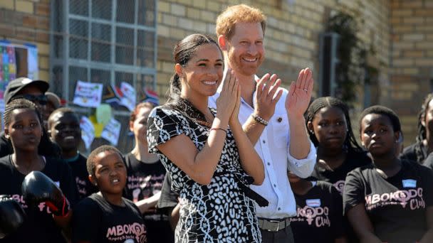 PHOTO: Britain's royal couple Prince Harry and Meghan, Duchess of Sussex, greet youths on a visit to the Nyanga Methodist Church in Cape Town, South Africa, Sept, 23, 2019. (Courtney Africa/Pool via AP)