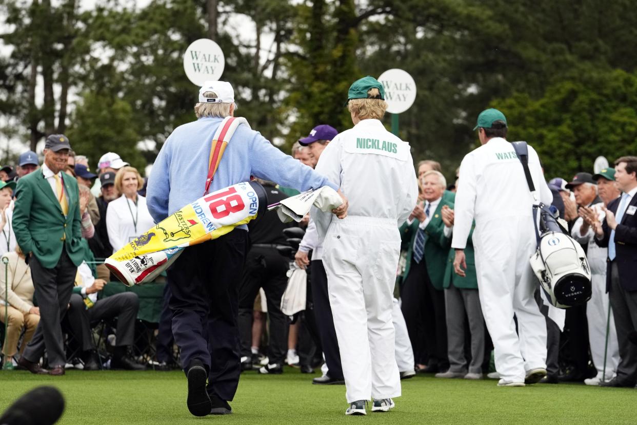 Apr 11, 2024; Augusta, Georgia, USA; Jack Nicklaus and his wife Barbara walk off the No. 1 tee after the honorary start for the first round of the Masters Tournament. Mandatory Credit: Rob Schumacher-USA TODAY Network