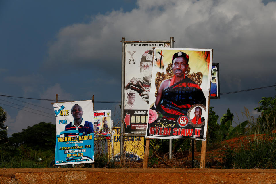 Obituaries and political posters along a road in Denyase, Ashanti region, Ghana. (Photo: Francis Kokoroko/Reuters)