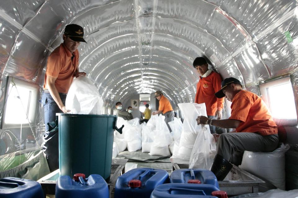 Officials prepare to seed clouds in the northern province of Chiang Mai, 435 miles north of the Thai capital Bangkok, in 2007 (Reuters)