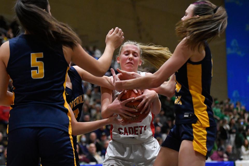 Hilton's Madison Murphy, center, fights for possession during a NYSPHSAA Class AA Girls Basketball Championships semifinal in Troy, N.Y., Friday, March 15, 2024. Hilton advanced to the Class AA final with a 73-71 overtime win against Averill Park-II.