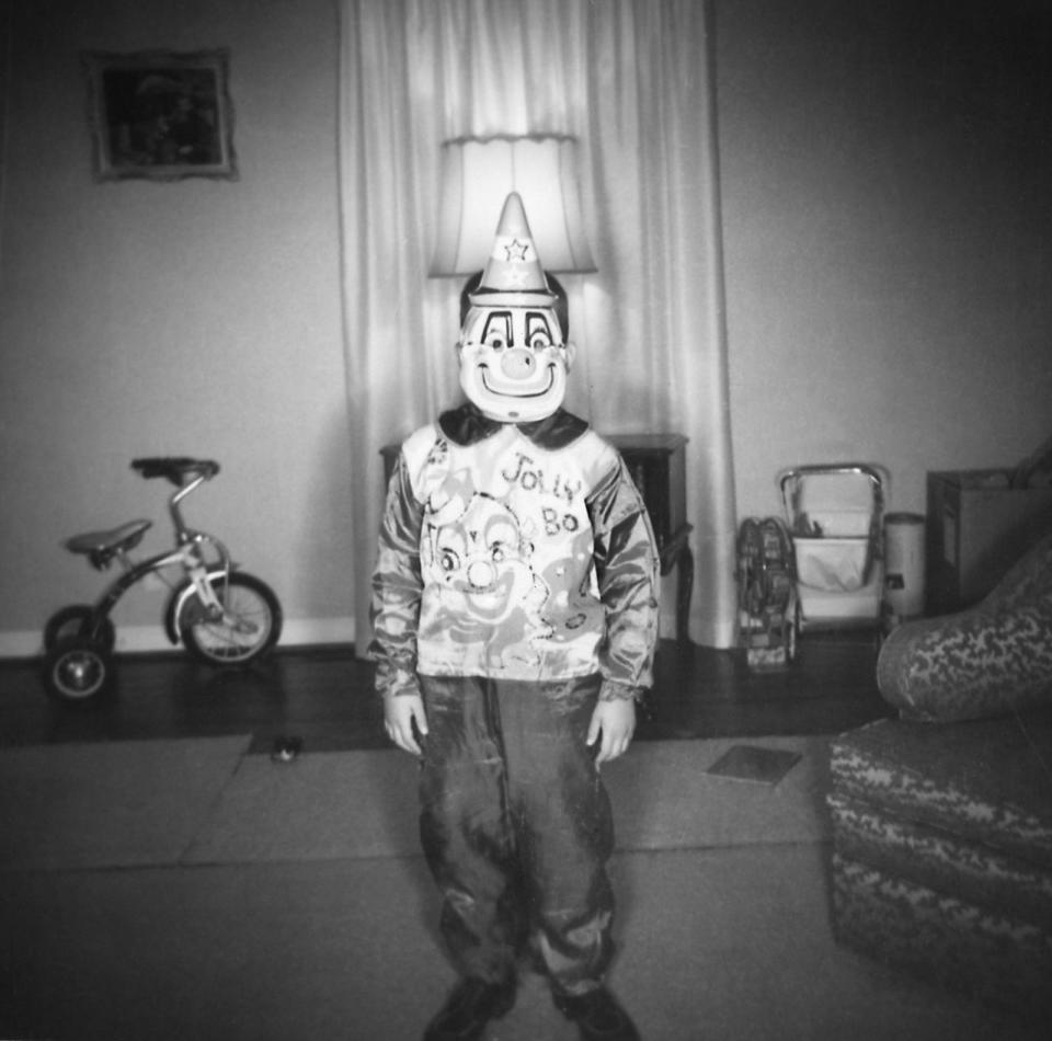 <p>A little boy wears a clown costume on Halloween in 1948.</p>