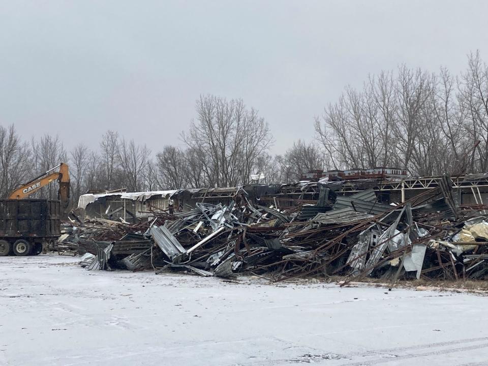 Demolition work continued Thursday, Jan. 20, 2022, at the site of a former Marsh supermarket at Burlington Road and Memorial Drive. Plans call for a 60-unit affordable housing development called Riverbend Flats at the site, with construction to start in spring.