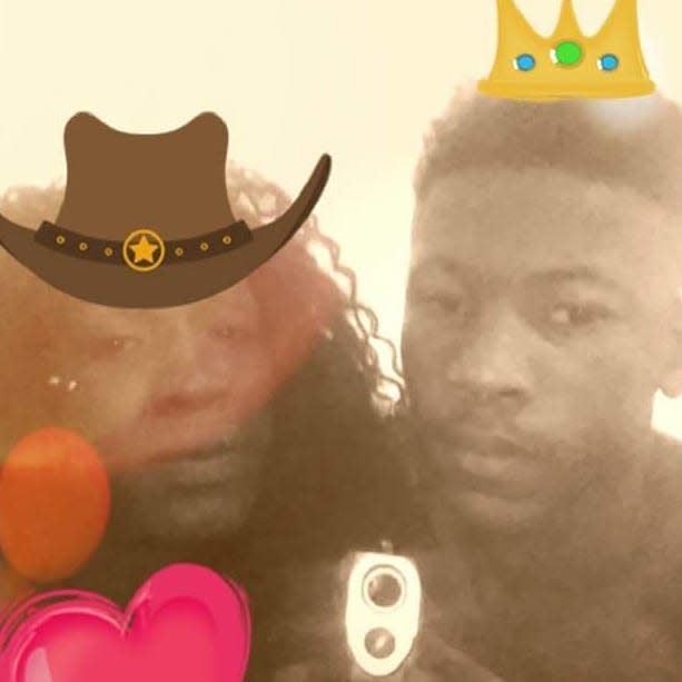 A facsimile Polaroid image of Jaylow McGlory and Desmond Harris with a cowboy hat emoji, crown emoji, and heart.