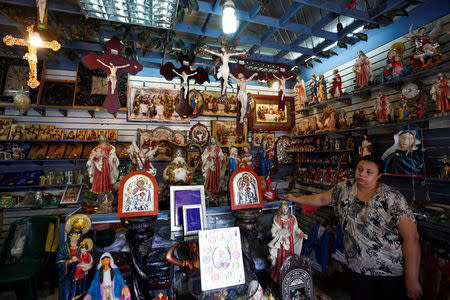 A woman stands inside a Christian souvenir shop ahead of Pope Francis’ visit in Cairo, Egypt April 27, 2017. REUTERS/Amr Abdallah Dalsh