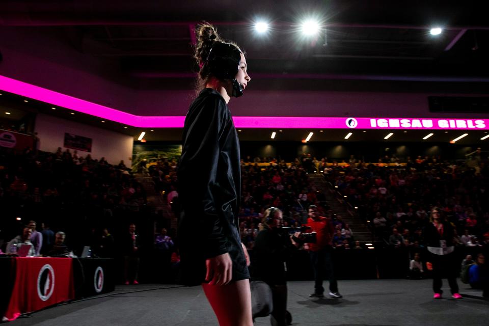 Raccoon River's Katie Biscoglia is introduced before wrestling at 100 pounds in the finals during the IGHSAU state girls wrestling tournament, Friday, Feb. 3, 2023, at the Xtream Arena in Coralville, Iowa.