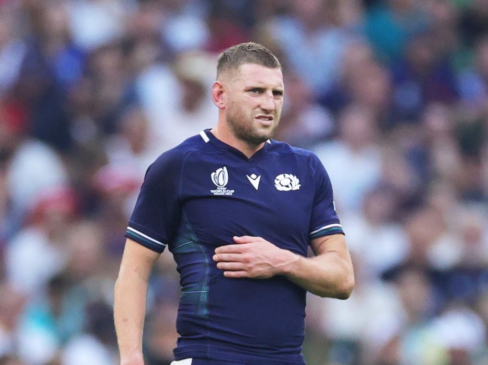 Finn Russell of Scotland clutches his ribs having appeared to have suffered an injury (Getty Images)