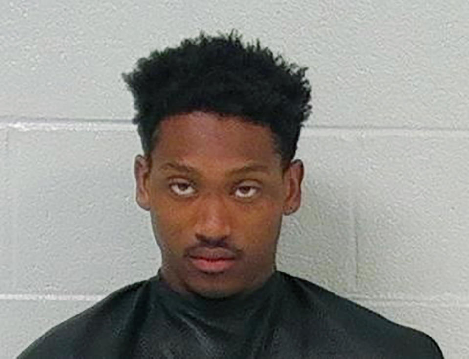 This undated booking photo provided by the Carroll County, Ga., Sheriff's Office shows Aaron Shelton. Three Georgia police officers were shot and wounded as they pursued brothers Aaron Jajuan Shelton and Pier Alexander Shelton, from Alabama, in a high-speed chase that ended early Monday, April 12, 2021, with Pier shot and killed and Aaron in custody, authorities said. (Carroll County Sheriff's Office via AP)