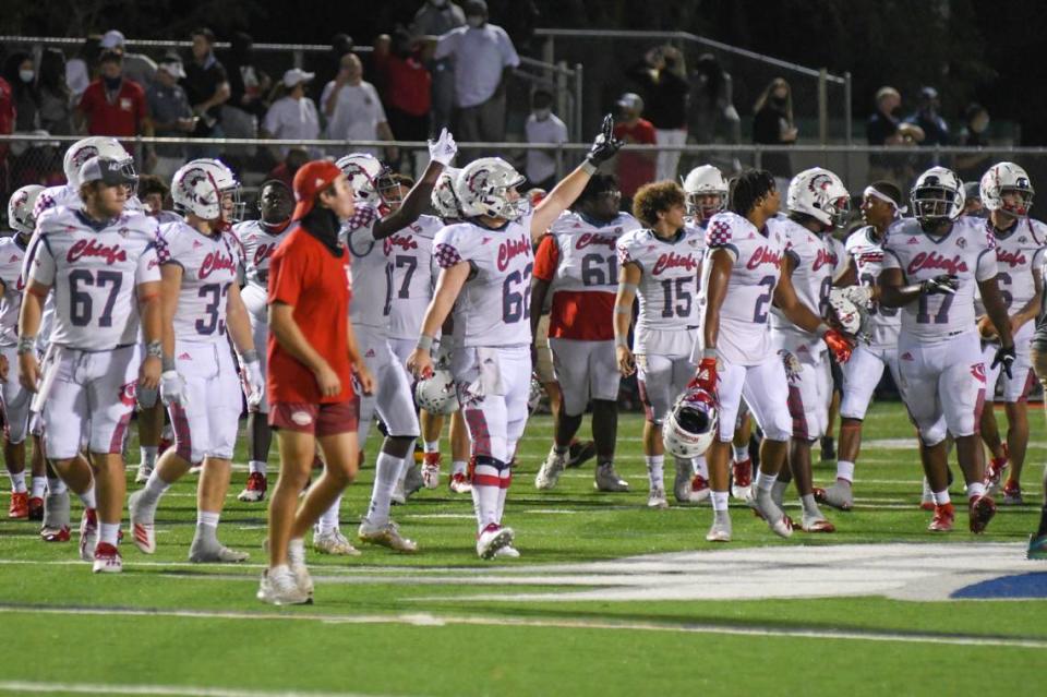 The Cardinal Gibbons football team walks off the field after defeating Delray American Heritage in the Region 4-4A finals on Friday, Nov. 27, 2020.