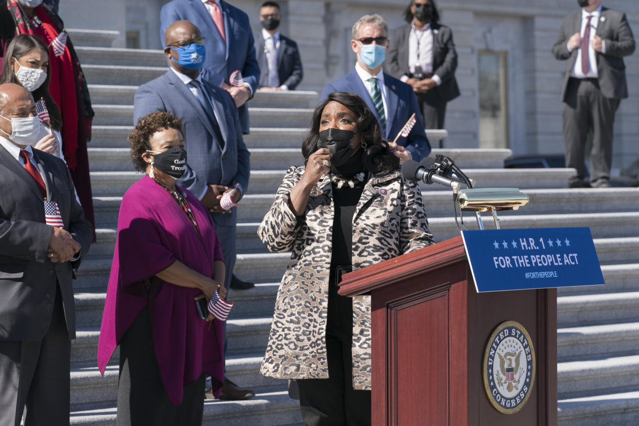 Rep. Terri Sewell, D-Ala., recalls the work of the late Rep. John Lewis as Democrats gather to address reporters on H.R. 1, the For the People Act of 2021, at the Capitol in Washington, Wednesday, March 3, 2021. House Democrats are poised to pass a sweeping elections and ethics bill, offering it up as a powerful counterweight to voting rights restrictions advancing in Republican-controlled statehouses. (AP Photo/J. Scott Applewhite)