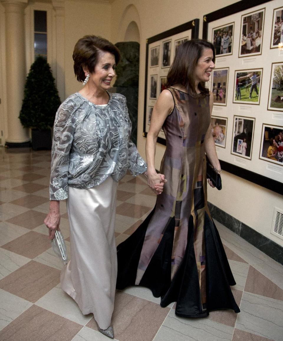 House Democratic Leader Nancy Pelosi, D-Calif., and Jacqueline Kenneally, arrive for a State Dinner in honor of French President François Hollande, at the White House in Washington, Tuesday, Feb. 11, 2014. (AP Photo/Manuel Balce Ceneta)