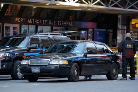 FBI agent is seen outside the New York Port Authority Bus Terminal in New York City, U.S. December 11, 2017 after reports of an explosion. REUTERS/Lucas Jackson