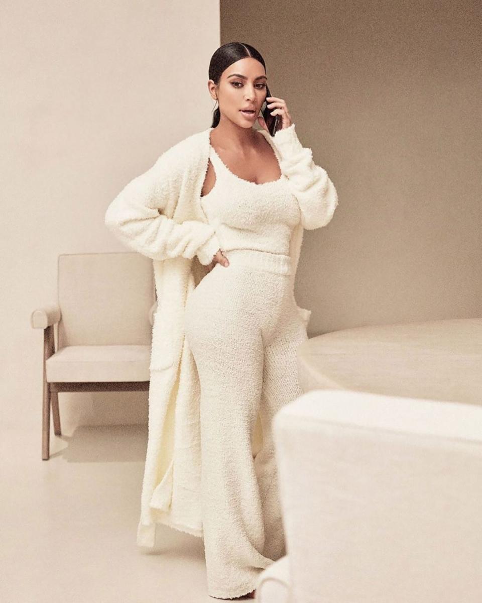 Kim knows how to rock loungewear, these wide-leg, Cozy Knit Pants retail for $137. Photo: SKIMS
