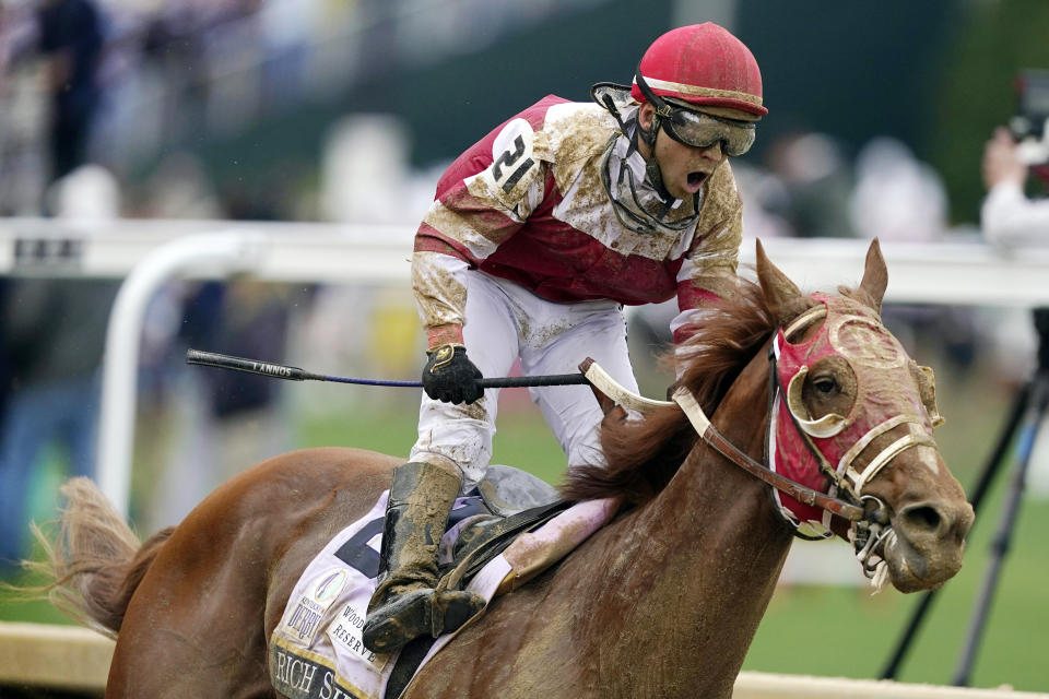 FILE- Jockey Sonny Leon celebrates after riding Rich Strike past the finish line to win the 148th running of the Kentucky Derby horse race at Churchill Downs Saturday, May 7, 2022, in Louisville, Ky. Rich Strike, upset winner of the 2022 Kentucky Derby, has been retired after injuries kept him from returning to racing. The 4-year-old colt will be sold as a stallion prospect. (AP Photo/Charlie Neibergall, File)