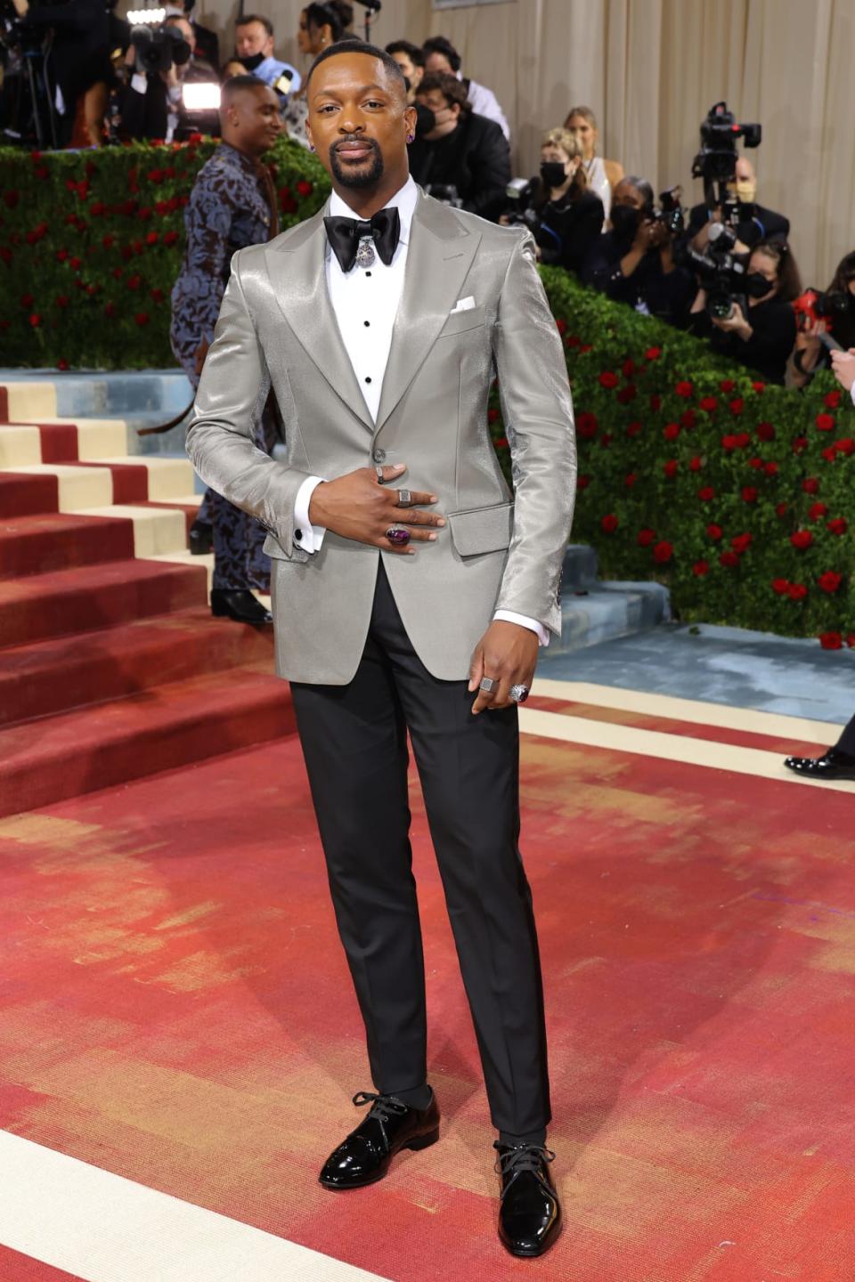 <div class="inline-image__caption"><p>Forgoing the Gilded Era-appropriate three-piece suit complete with tails that many other guys have been adopting, LaQuan Smith instead opted for a slick silver jacket and a bow tie complete with a bell; he also designed LaLa Anthony’s look.</p></div> <div class="inline-image__credit">Mike Coppola/Getty</div>