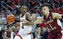 North Carolina State's Terquavion Smith (0) drives by Florida State's Jalen Warley (1) during the first half of an NCAA college basketball game, Wednesday, Feb. 1, 2023 in Raleigh, N.C. (Ethan Hyman/The News & Observer via AP)