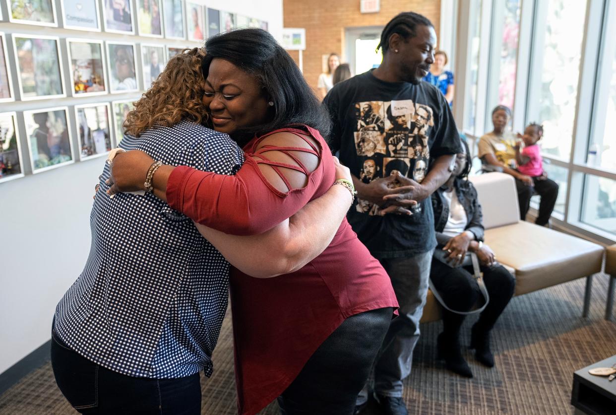 Jess Schnur, left, embraces Ronna Dixon-Young as the two meet in person for the first time on Sunday at the offices of Lifeline of Ohio, a nonprofit organ donor procurement organization based in Columbus. Schnur, a nurse from Indiana who suffers from an autoimmune liver disease, received a liver from Dixon-Young's son, DeVille Deonte Morrow, after he passed away Aug. 9, 2021.
