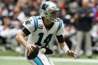 Carolina Panthers quarterback Sam Darnold (14) runs out of the pocket against the Atlanta Falcons during the first half of an NFL football game, Sunday, Oct. 31, 2021, in Atlanta. (AP Photo/Mark Humphrey)