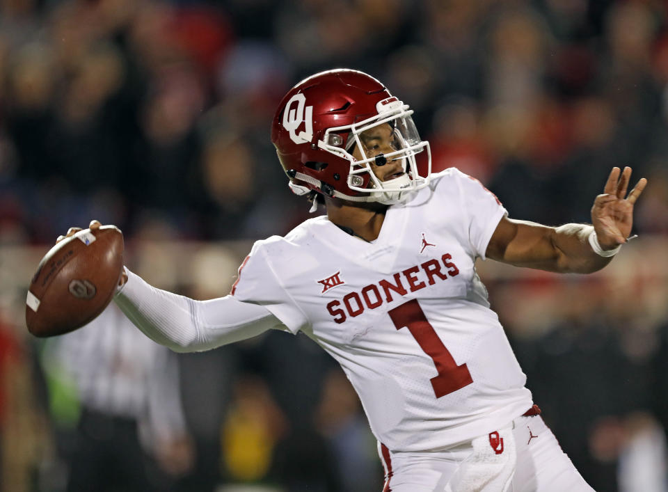 Oklahoma's Kyler Murray (1) passes the ball downfield during the first half of an NCAA college football game against Texas Tech, Saturday, Nov. 3, 2018, in Lubbock, Texas. (AP Photo/Brad Tollefson)