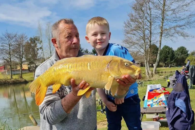 David Carpenter with his grandson fishing