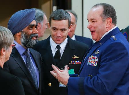 Canadian Defense Minister Harjit Singh Sajjan (L) and NATO Supreme Allied Commander, U.S. Air Force General Philip Breedlove (R) attend a NATO defense ministers meeting at the Alliance's headquarters in Brussels February 10, 2016. REUTERS/Yves Herman