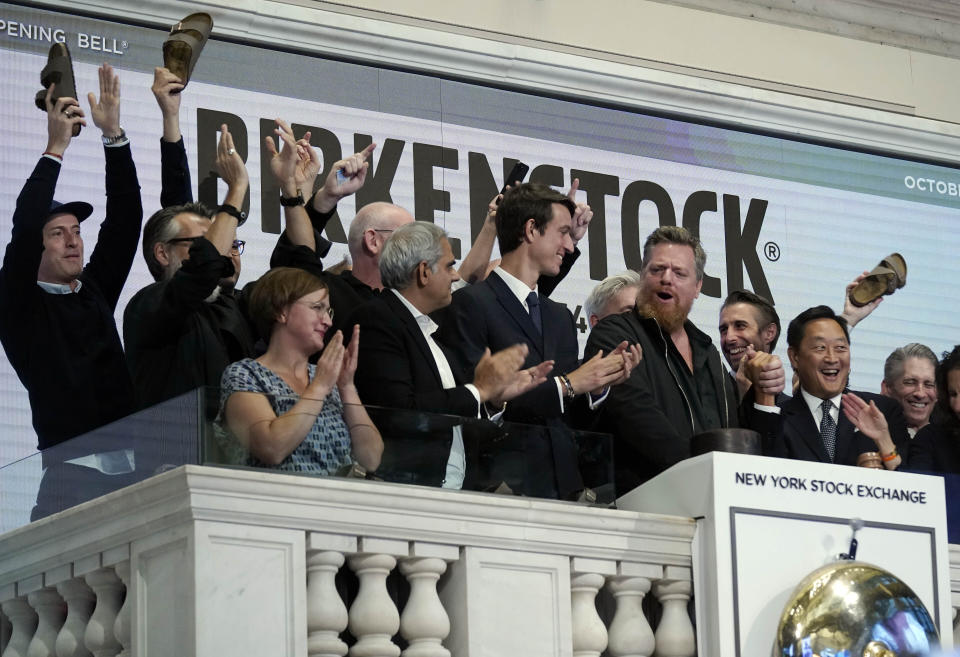 Birkenstock CEO Oliver Reichert, second from right, rings the New York Stock Exchange opening bell, prior to his company's IPO, Wednesday, Oct. 11, 2023. (AP Photo/Richard Drew)